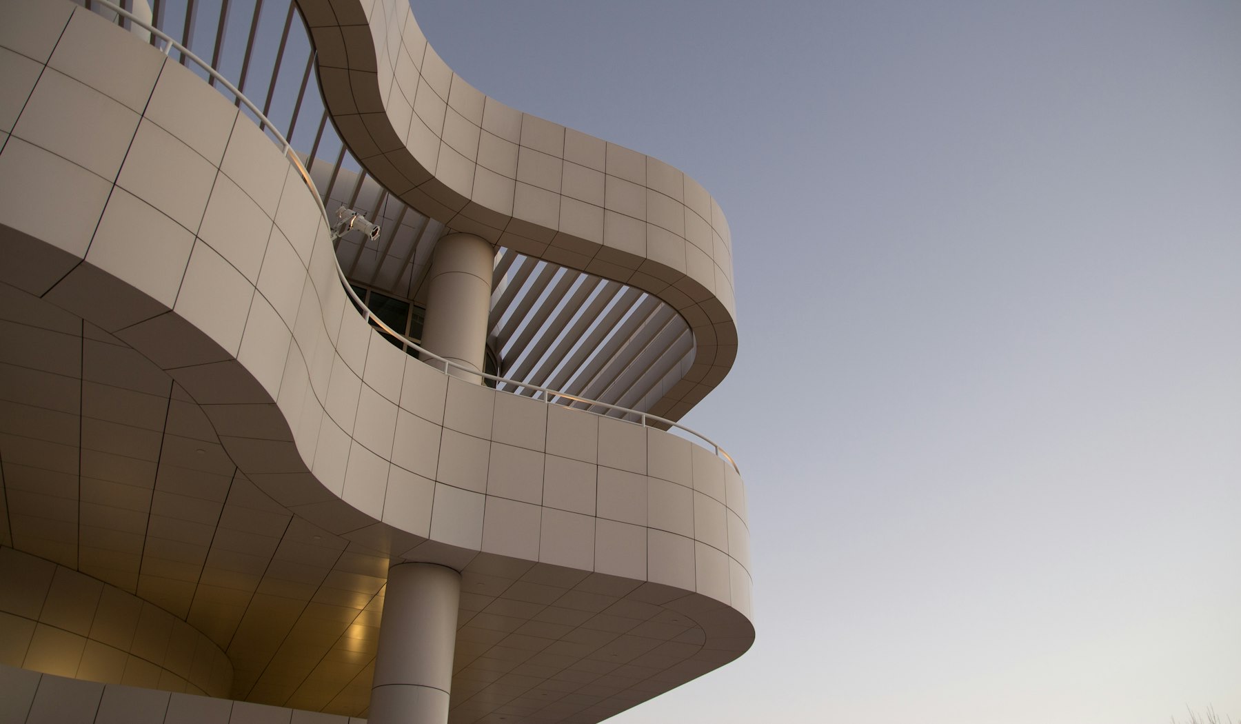 Curved limestone facade of a modern private office building