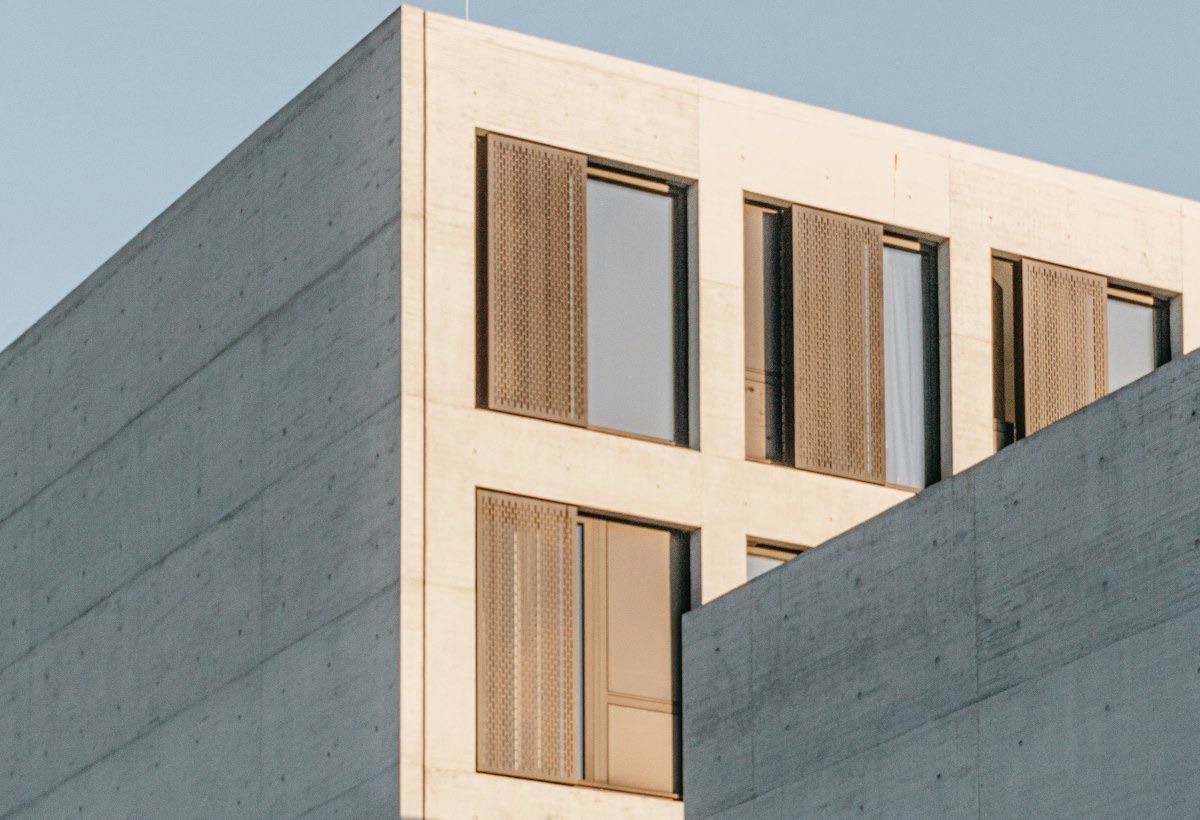 Concrete and warm timber detail of a contemporary building exterior