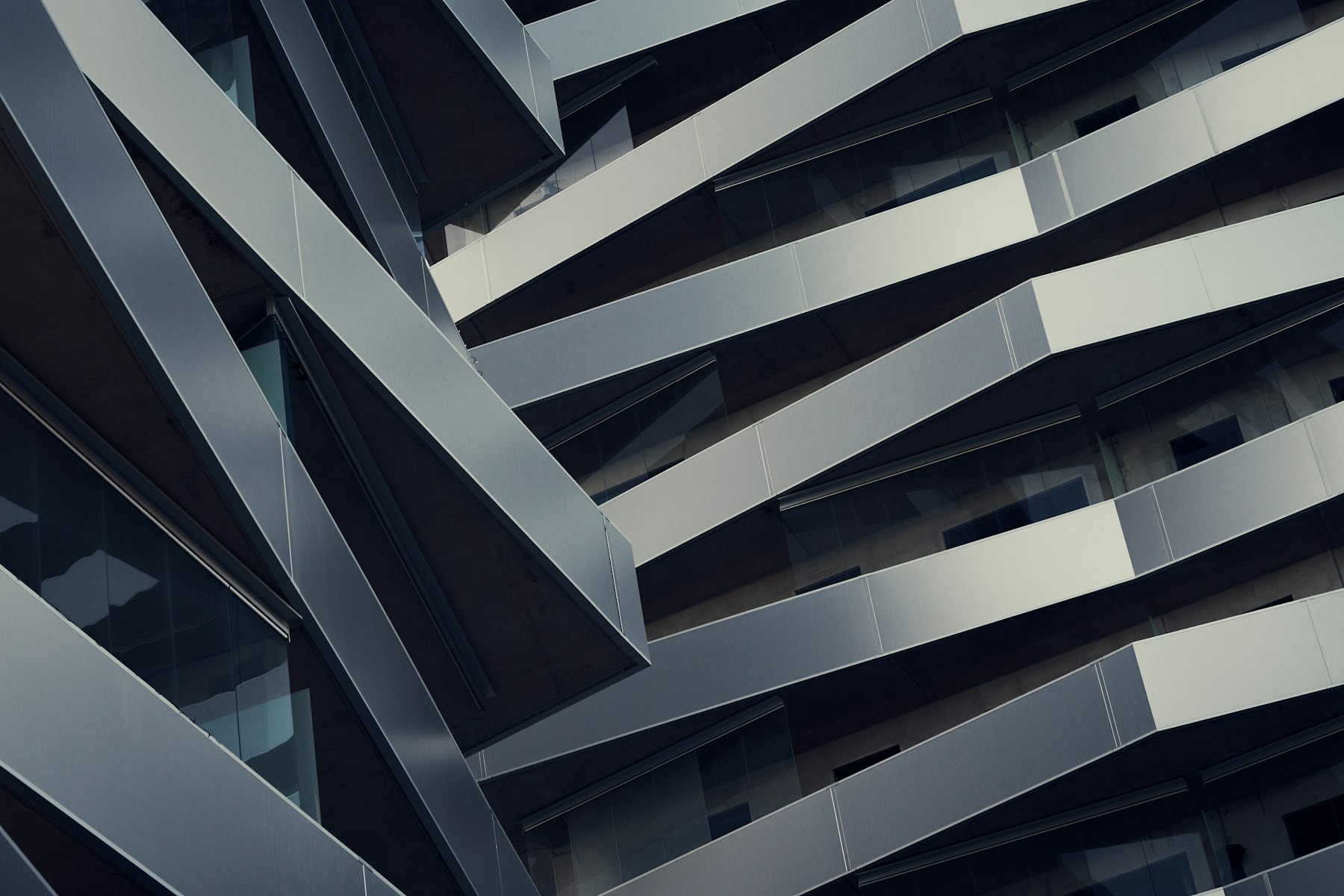 Dark geometric facade of a corporate headquarters